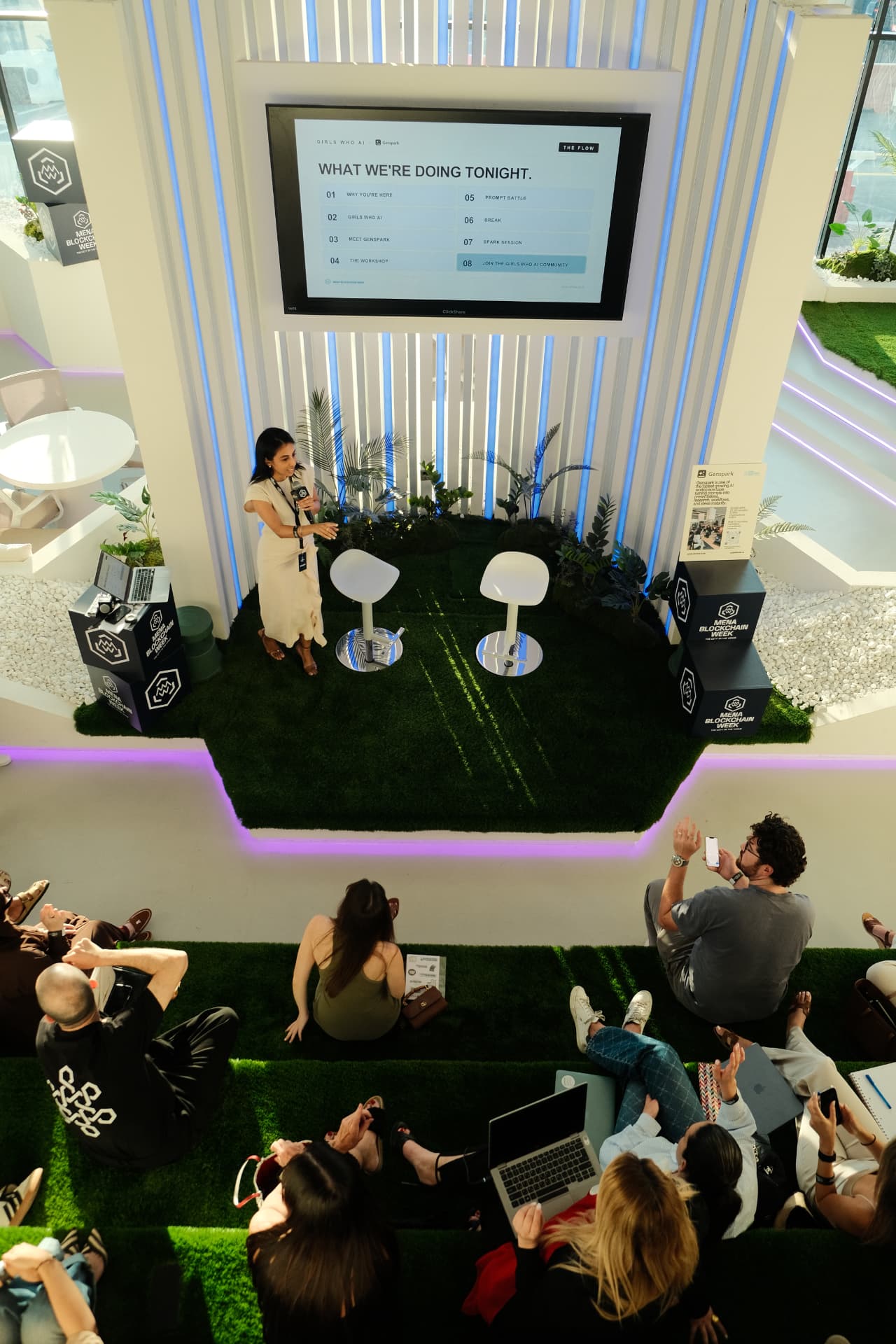Speaker leading a Girls Who AI workshop on stage